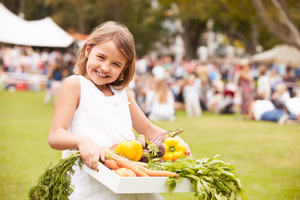 girl holding food donation