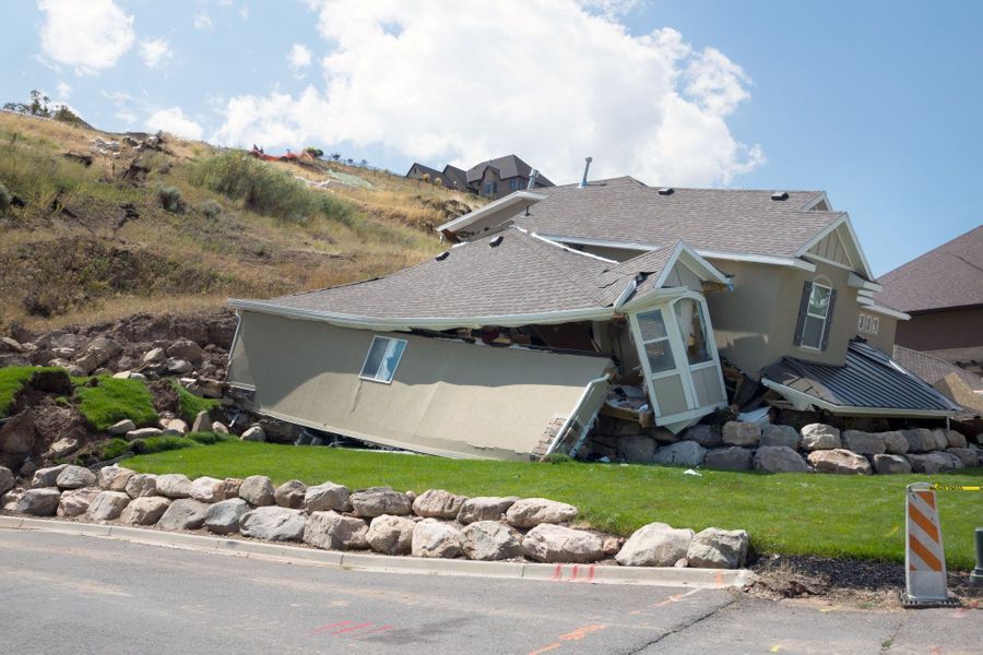 house damaged by rock slide