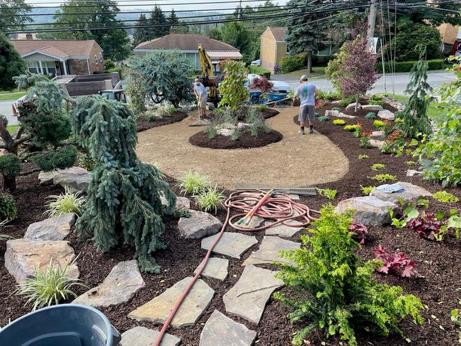 Image of workers working on a landscape design