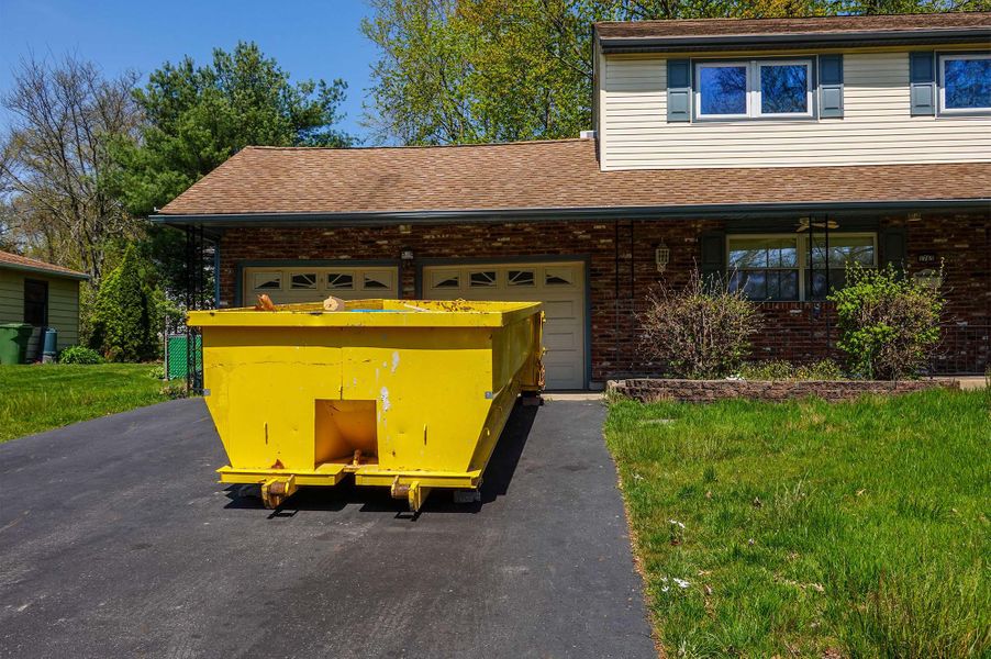 Stone junk removal dumpster