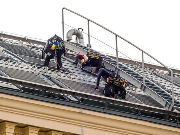 roofing contractors working on roof