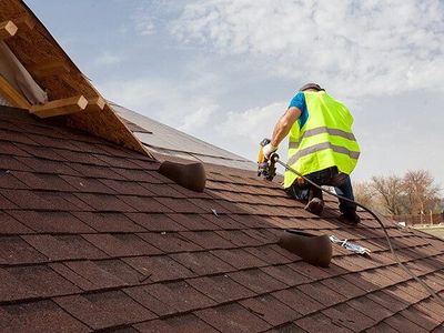 roofer and shingles