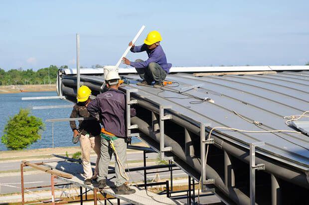 roofing contractors working on roof