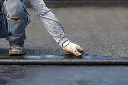 roofing contractor on roof