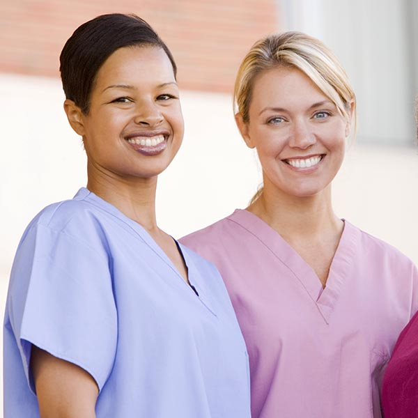Two smiling nurses