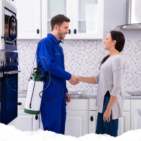 Pest control professional and homeowner shaking hands