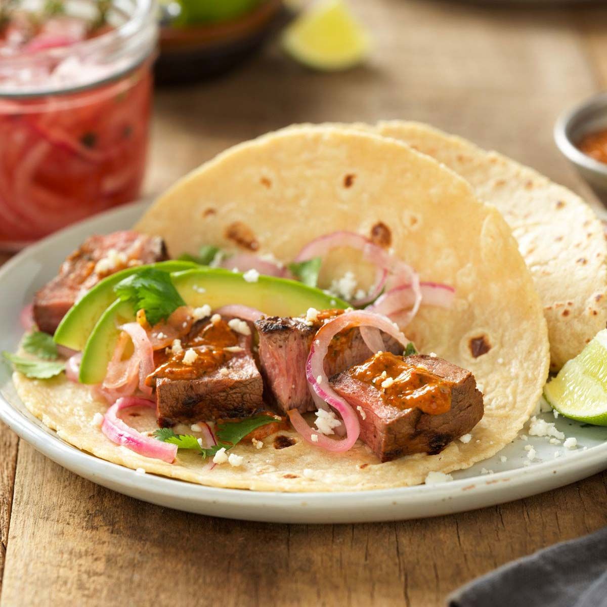 Grilled Adobo Beef Steak Tacos with Creamy Chipotle Salsa and Tequila-Pickled Red Onions