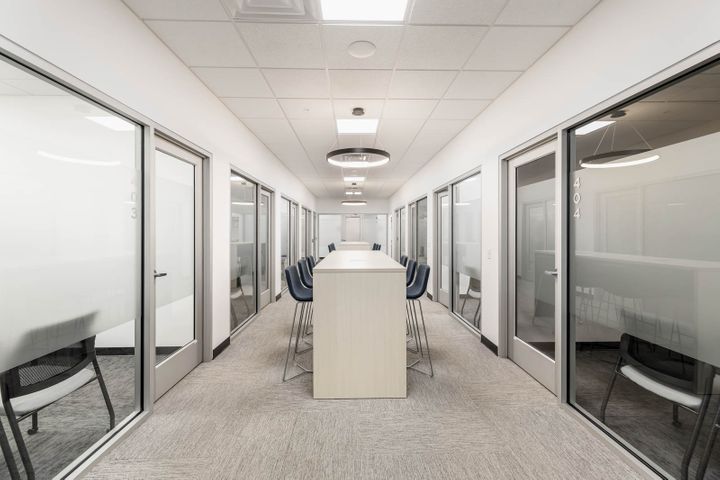 Office renovation with central collab space at Mosaic Technologies in Cameron, WI – Hoeft Builders