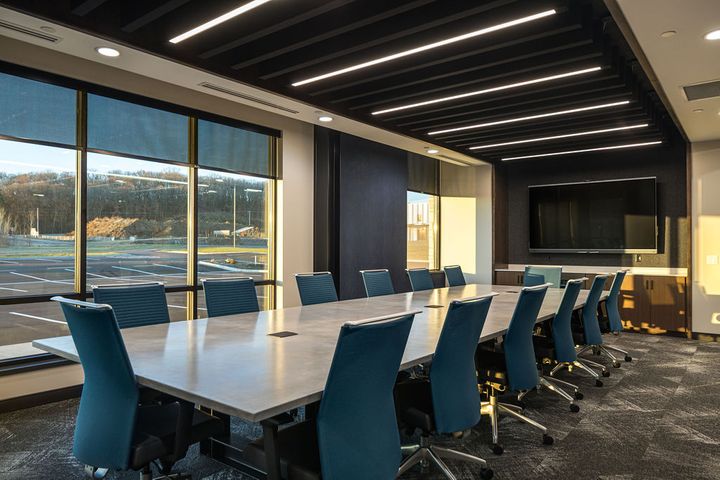 Conference room construction at Hoeft Builders in Eau Claire, WI, featuring a poured-in-place concrete table Corporate office conference room for Hoeft Builders in Eau Claire, Wi