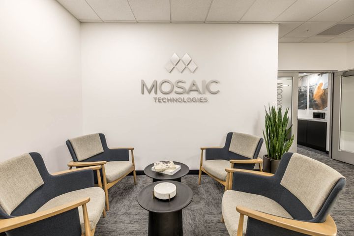 Office renovation with a modern waiting room at Mosaic Technologies in Cameron, WI – Hoeft Builders