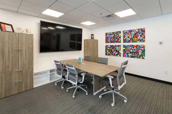 Car dealership renovation meeting area at One Automotive in Eau Claire, WI - Hoeft Builders