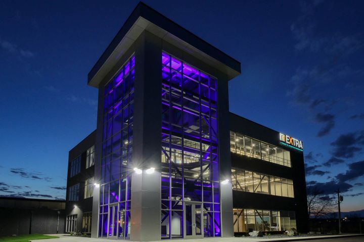 Nighttime exterior construction for Elite Extra office in Eau Claire, WI - Hoeft Builders