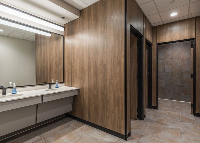 Office bathroom construction at Hoeft Builders in Eau Claire, WI featuring floor-to-ceiling partitions. Office bathroom construction at Hoeft Builders in Eau Claire, WI