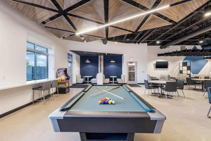 Breakroom with a pool table in an office remodel project for Mosaic Technologies in Cameron, WI – Hoeft Builders