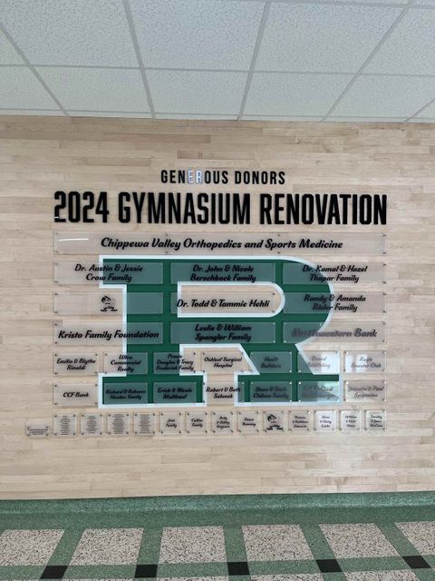 Repurposed gym flooring focal wall at Regis High School in Eau Claire, WI - Hoeft Builders