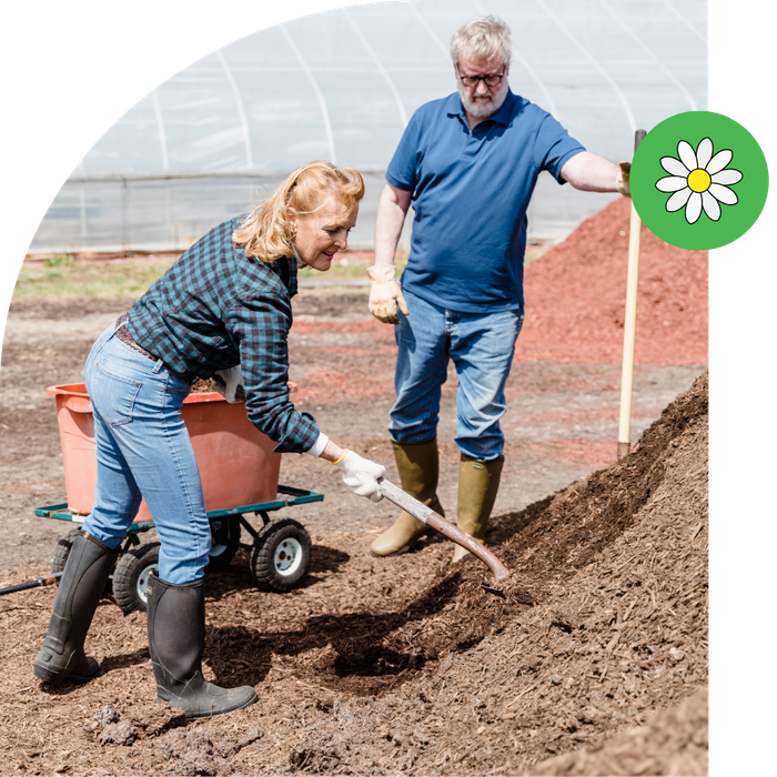 couple working with landscaping materials