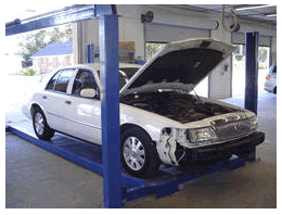 Image of a car in the shop with the hood up