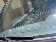 Image of a car with the windshield broken