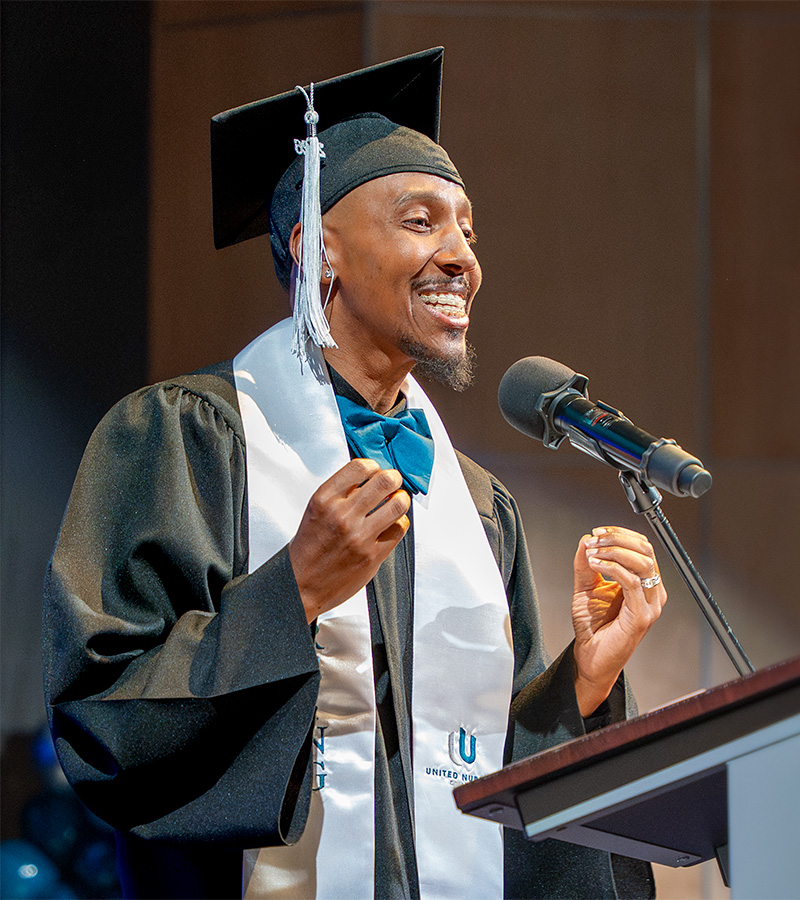 UNC graduate Terry smiling in cap and gown