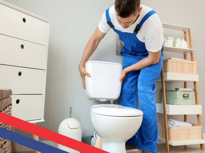 man installing toilet